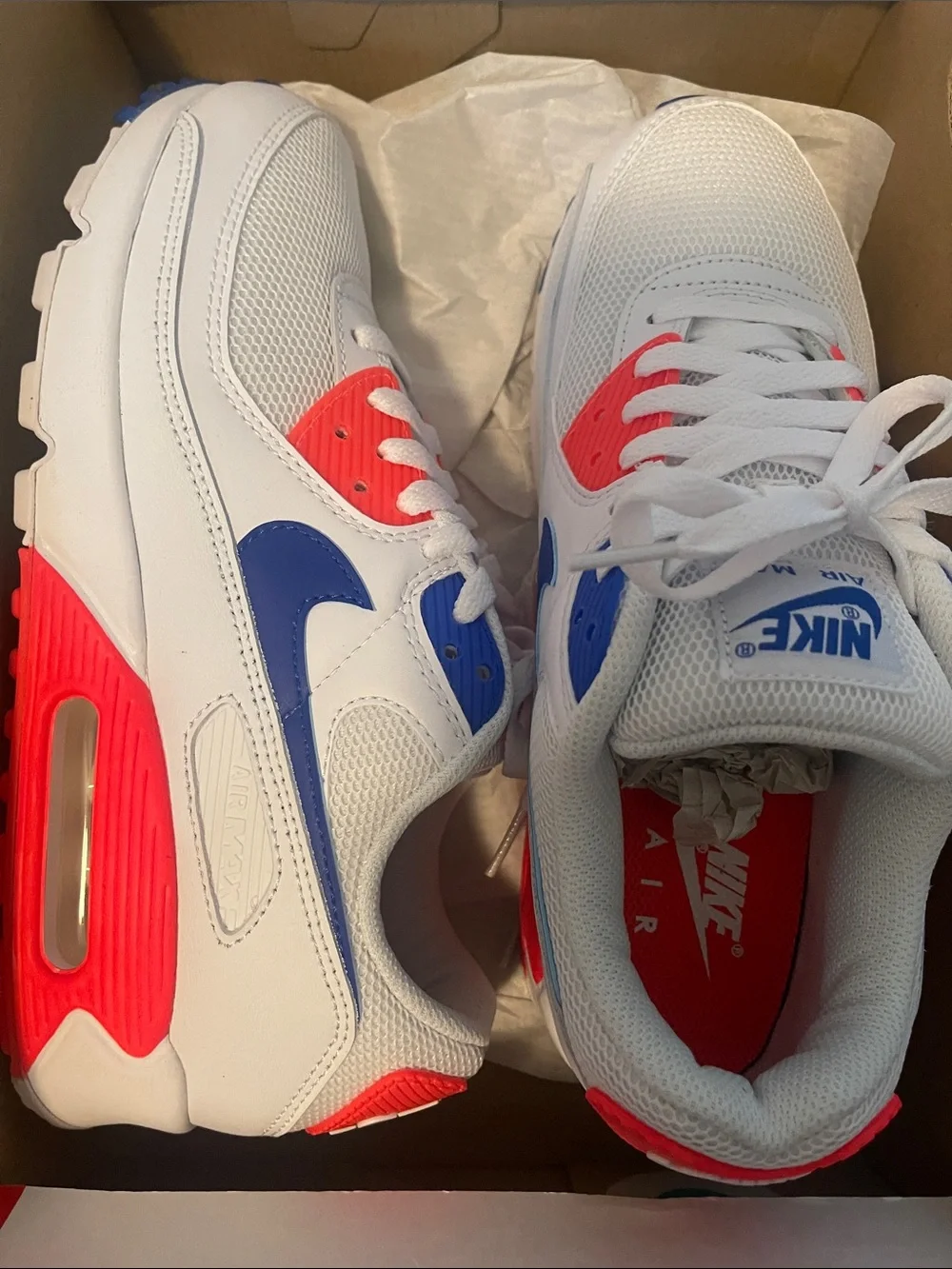 Nike Women's White Sneakers with Blue Swoosh and Neon Coral Accents